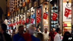 People visit a market in Istanbul, July 19, 2018. 