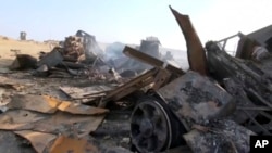 FILE - An image made from video shows a site after a U.S. airstrike in Hodeida,Yemen, Oct. 13, 2016. 
