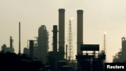 FILE - A view of Venezuela's Amuay Oil refinery during daybreak in Punto Fijo, 545 km (340 miles) west of Caracas, May 18, 2006. 