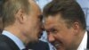 Президент Росії Володимир Путін (ліворуч) та голова правління російського «Газпрому» Олексій Міллер
