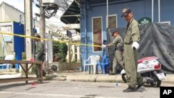 Investigators work at the scene of an explosion in the resort town of Hua Hin, 240 kilometers (150 miles) south of Bangkok, Aug. 12, 2016. 
