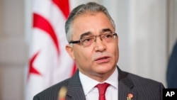 FILE - Tunisian Minister for Political Affairs Mohsen Marzouk, speaks at the Blair House in Washington, May 20, 2015.