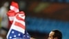 US midfielder Landon Donovan waves the US flag after the Group C first round 2010 World Cup football match US versus Algeria at Loftus Verfeld stadium in Tshwane/Pretoria. US won the match 1-0, 23 June 2010.