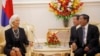 Cambodia's Prime Minister Hun Sen (R) and International Monetary Fund (IMF) Managing Director Christine Lagarde speak during a meeting at the Prime Minister's office in central Phnom Penh December 2, 2013. Lagarde is visiting Cambodia for two days in the first of a three-leg visit to Asia. REUTERS