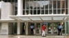 Private security guards stand at the entrance of the headquarters of the World Bank, in Washington D.C., file photo. 