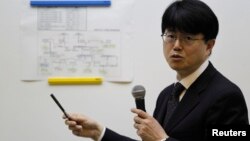 FILE - TEPCO General Manager Masayuki Ono speaks during a news conference at the company's head office in Tokyo, March 19, 2013.