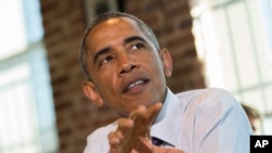 FILE - To enhance cybersecurity, President Barack Obama is calling for greater exchange of information among federal agencies and private companies. 
