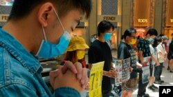 Protesters gather at a shopping mall in Central during a pro-democracy protest against Beijing's national security law in Hong Kong, Tuesday, June 30, 2020. Hong Kong media are reporting that China has approved a contentious law that would allow…