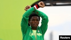 FILE - Ethiopian distance runner Feyisa Lilesa made headlines when he crossed his wrists above his head, a symbol that has become the rallying cry for protests in the Oromia region of Ethiopia.