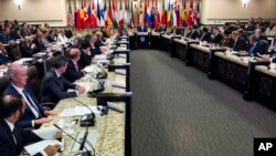 FILE - Representatives of the Global Coalition to Counter IS meet at Joint Base Andrews, Maryland, outside Washington, D.C., July 20, 2016.
