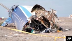 FILE - In this photo taken from a video released by the administration of Mangystau region, the wreckage of Azerbaijan Airlines Embraer 190 lies on the ground near the airport of Aktau, Kazakhstan, Dec. 25, 2024. 