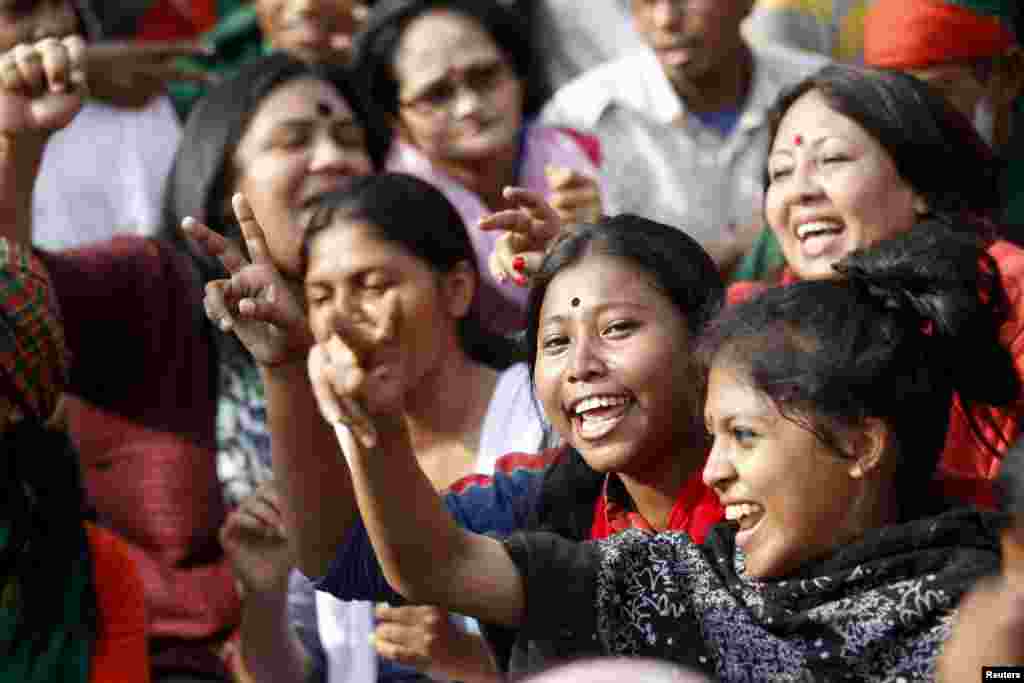 People celebrate after the Supreme Court rejected Abdul Quader Mollah's request for an appeal against his death sentence in Dhaka, Dec. 12, 2013.