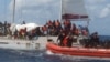Bato Gad Kot Escanaba arete yon vwalye ki gen migran Ayisyen abo l nan lanme tou pre Kiba, 10 Fevriye, 2025. 