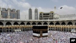 Muslim pilgrims circumambulate around the Kaaba, the cubic building at the Grand Mosque, ahead of the Hajj pilgrimage in the Muslim holy city of Mecca, Saudi Arabia, Aug. 8, 2019.