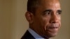 President Barack Obama pauses while speaking in the East Room of the White House in Washington, June 10, 2013.