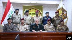 Iroq Bosh vaziri Haydar al-Ibodiy harbiy qo'mondonlar bilan, Bag'dod, 17-oktabr, 2016