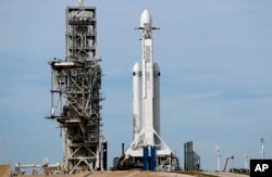 A Falcon 9 SpaceX heavy rocket stands ready for launch on pad 39A at the Kennedy Space Center in Cape Canaveral, Feb. 5, 2018.