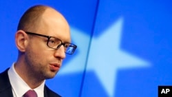Ukraine's Prime Minister Arseniy Yatsenyuk speaks during a media conference at an EU summit in Brussels on March 6, 2014.