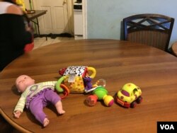 A recent spate of immigration raids have left families scared of opening the door or leaving their home. (C. Presutti/VOA)