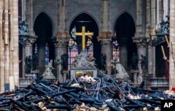 Debris are seen inside Notre Dame cathedral in Paris, April 16, 2019.