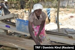 Eunice Atieno, 40, prepares her workplace at the Osiri-Matanda mines in Nyatike, Migori County, Kenya, Feb. 3, 2018.