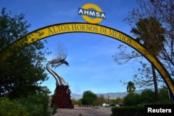 FILE - The logo of Mexican steelmaker Altos Hornos de Mexico is seen in Monclova, Mexico, Aug. 14, 2018.