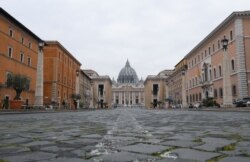 A view of St. Peter's Square, on the fourth day of an unprecedented lockdown across of all Italy imposed to slow the outbreak of coronavirus, as seen from Rome, Italy.