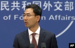 FILE - Chinese Foreign Ministry spokesman Geng Shuang speaks during a media briefing in Beijing in this July 17, 2019, image from video.