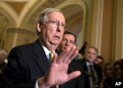 Senate Majority Leader Mitch McConnell, R-Ky., tells reporters he is delaying a vote on the Republican health care bill while the GOP leadership works toward getting enough votes, at the Capitol in Washington, D.C., June 27, 2017.