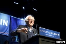 FILE -- U.S. Democratic presidential candidate and U.S. Senator Bernie Sanders smiles as he waves to supporters at a campaign rally in Portland, Maine, on March 2, 2016.