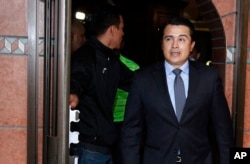 n this March 16, 2017 photo, Antonio Hernandez, brother of the current Honduran president, arrives to hold a press conference in Tegucigalpa, Honduras. A leader of a drug trafficking organization alleges that Hernandez asked him for a bribe.