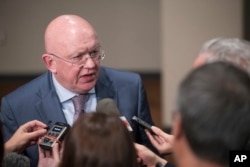 FILE - Russia's U.N. Ambassador Vassily Nebenzia speaks to reporters after attending a Security Council meeting, Aug. 9, 2017, at U.N. headquarters.