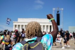 Demonstrators gather in front of the Lincoln Memorial for the "Get Your Knee Off Our Necks" march in support of racial justice that is expected to gather protestors from all over the country in Washington, U.S., August 28, 2020. REUTERS/Erin Scott