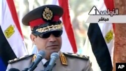 In this image taken from Egypt State TV, Egyptian army chief Abdel Fattah el-Sissi delivers a speech in Cairo, July 24, 2013.