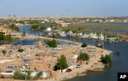 This aerial photo shows high levels of water in the Shatt al-Arab waterway near Basra, Iraq, April 22, 2019.