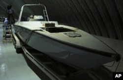 FILE - A craft described as a "drone boat," once loaded with explosives by Shiite rebels in Yemen, is displayed at a military installation in the United Arab Emirates, June 19, 2018. Officials involved in the Saudi-led campaign against Shiite rebels in Yemen, known as Houthis, showed journalists materiel captured on the battlefield that they alleged show Iran's hand in arming the rebels.