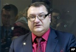 FILE - In this grab taken from Associated Press Television footage on Nov. 3, 2015, Yuri Grabovsky speaks during a trial hearing at the Holosiivskyi District Court in Kyiv, Ukraine. A lawyer for two Russian servicemen on trial in Ukraine has been found dead.