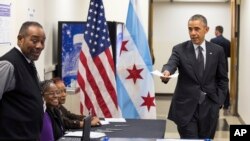 President Barack Obama arrives to cast a ballot at the Dr. Martin Luther King Community Service Center in Chicago, Oct. 20, 2014, while participating in early voting.