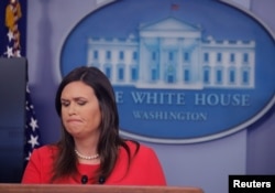 FILE - White House Press Secretary Sarah Sanders addresses reporters during a press briefing at the White House in Washington, Jan. 28, 2019.
