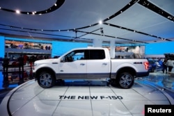 FILE - A 2018 Ford F-150 "King Ranch" pickup truck is displayed during the North American International Auto Show in Detroit, Michigan, Jan. 10, 2017.