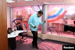Venezuela's President Nicolas Maduro dances during his radio program at Miraflores Palace in Caracas, Venezuela, Nov. 1, 2016. (Miraflores Palace/Handout)