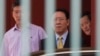North Korean Ambassador to Malaysia, Kang Chol, center, prepares to get in a car at the embassy in Kuala Lumpur, Malaysia, March 6, 2017. Malaysia is expelling Chol over the poisoning of Kim Jong Nam, the estranged half-brother of North Korea's leader. 
