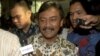 Indonesian Sports and Youth Minister Andi Alfian Mallarangeng is mobbed by the press after announcing his resignation in Jakarta, Indonesia, Dec. 7, 2012. 
