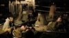 Israeli soldiers rest at a staging area outside the northern Gaza Strip, Nov. 21, 2012.