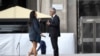 Italian singer Andrea Bocelli talks with his wife Veronica Berti prior to performing outside the Duomo cathedral, on Easter Sunday, in Milan, Italy, April 12, 2020. 