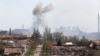 Smoke rises above a plant of Azovstal Iron and Steel Works company in Mariupol