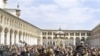Syrian protesters shout slogans outside the Omayyad Mosque after Friday prayers in Damascus, March 25, 2011
