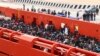 Migrants are seen aboard a navy ship before being disembarked in the Sicilian harbor of Augusta, June 1, 2014.