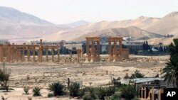 FILE - This file photo released May 17, 2015, by the Syrian official news agency SANA shows the general view of the ancient Roman city of Palmyra, northeast of Damascus, Syria. 