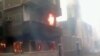 FILE - A Coptic church burning in Egypt.